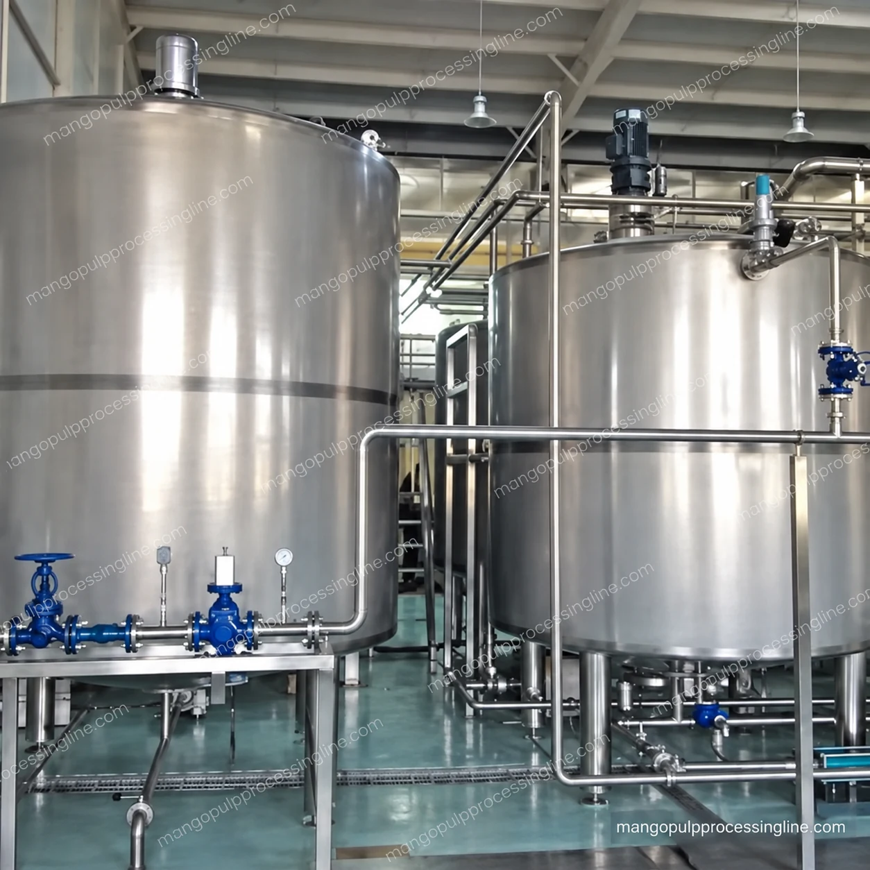 Connected stainless steel process vessels with bottom pipe connections and top fittings